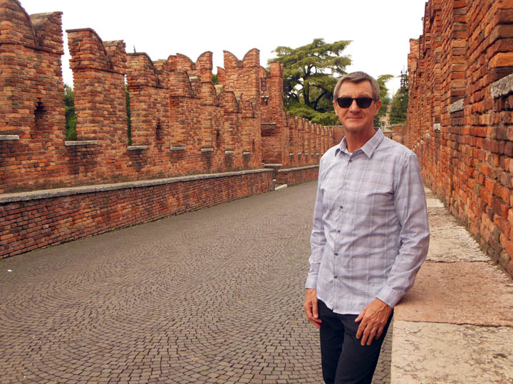 My handsome husband, Michael, standing on the Ponte Pietra.